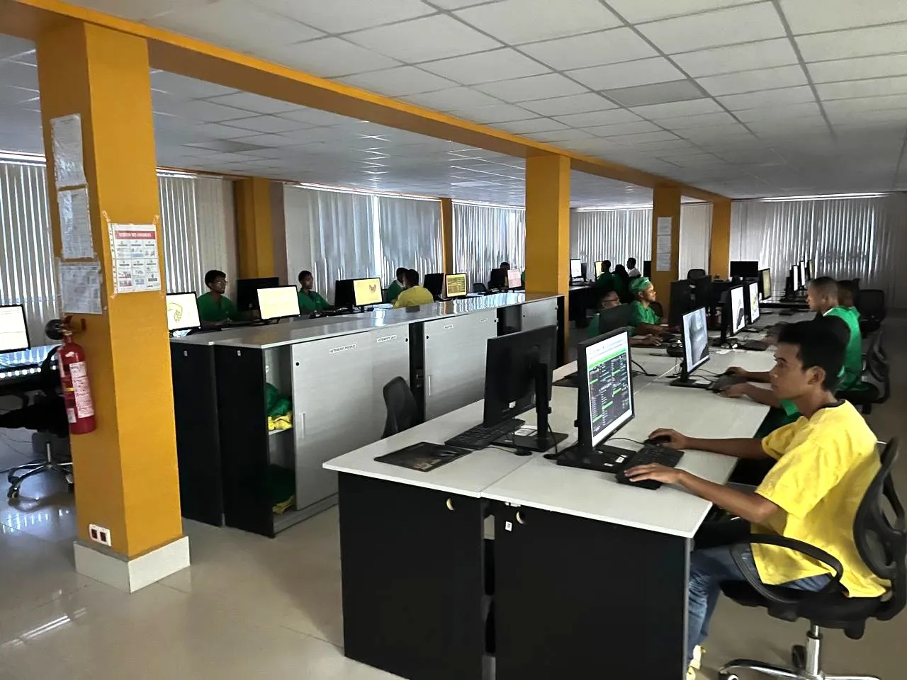 Technicians designing cases on CAD workstations